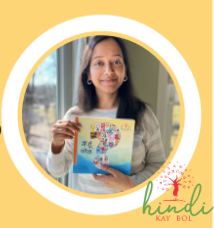 image of an Indian-American woman holding a picture book